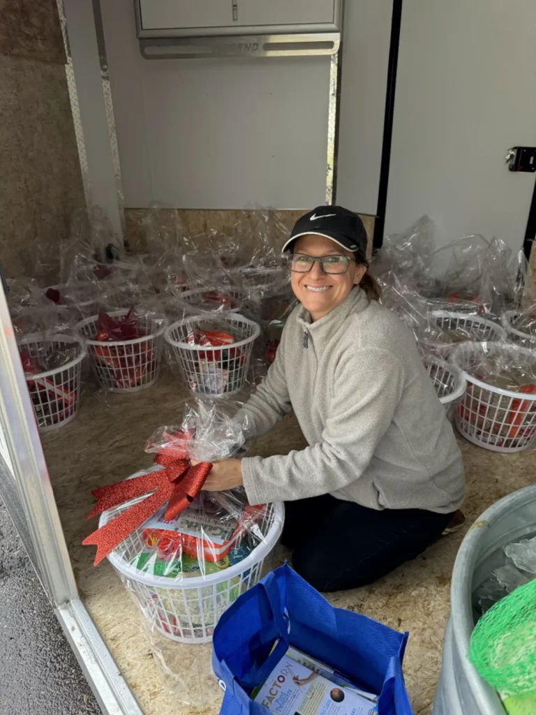 Memory Layne Global Mission - Amber handing mission gift baskets